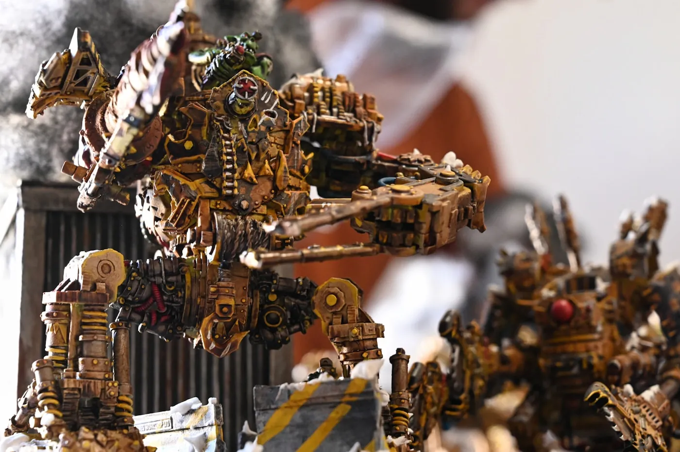 A painted warband of yellow mechanized ork walkers arranged as a cohesive army.